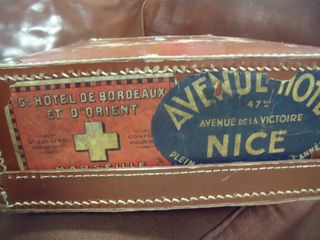 Suitcase with souvenir de voyage