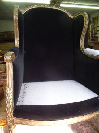 Pair of Louis XVI gilded armchairs with black velvet