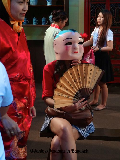 Girl with a mask in chinatown