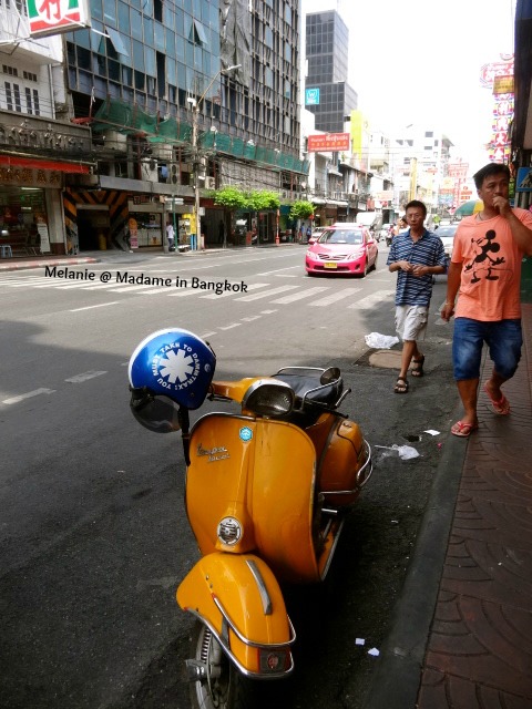 Orange vespa in Chinatown