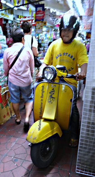 Yellow vespa in Chinatown sampeng lane