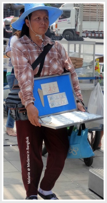 Streets of Bangkok lottery tickets seller on silom